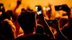 Should smartphones be locked away at gigs and in schools?